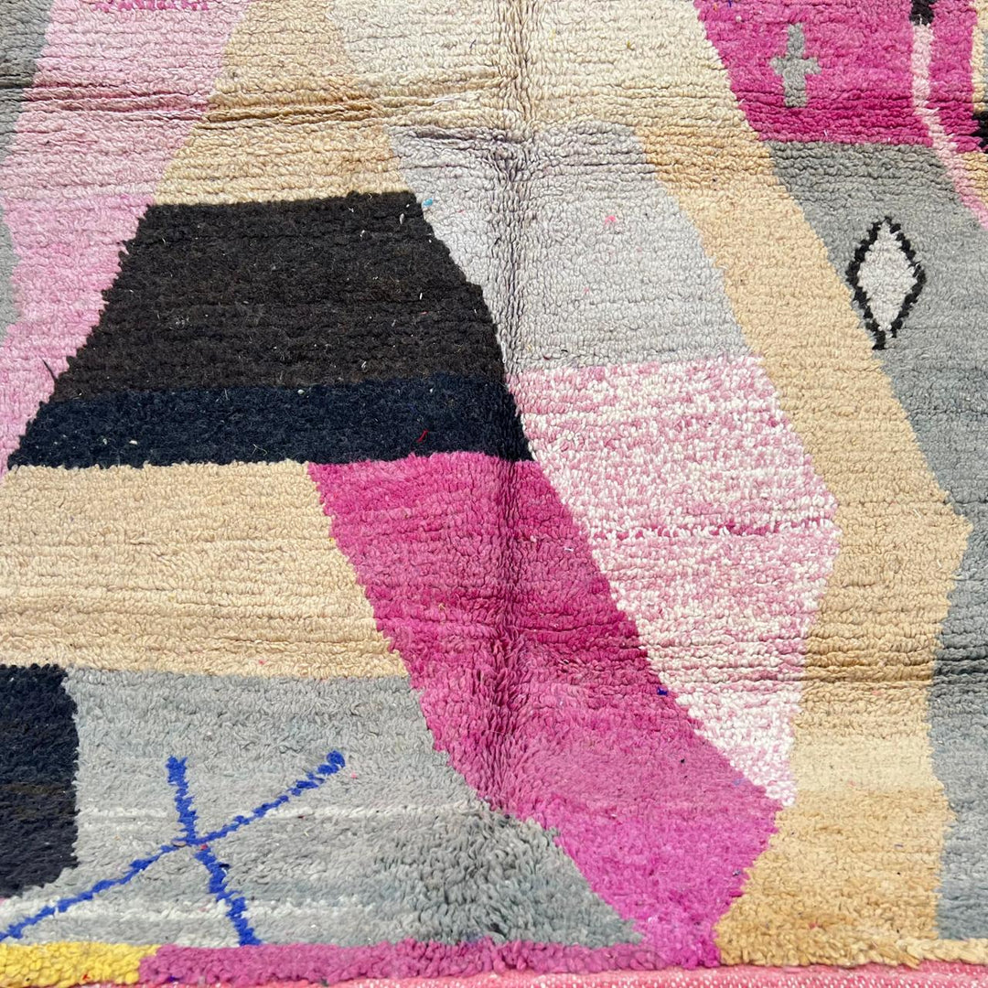 Vintage Moroccan wool rug with abstract geometric Berber design in blush pink, charcoal black, sage green and beige, handmade in Morocco.