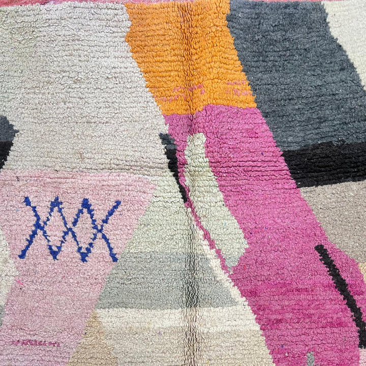 Vintage Moroccan wool rug with abstract geometric Berber design in blush pink, charcoal black, sage green and beige, handmade in Morocco.