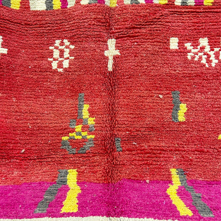 Vintage Moroccan striped wool rug with red pink yellow and gray Berber pattern, handmade in Morocco