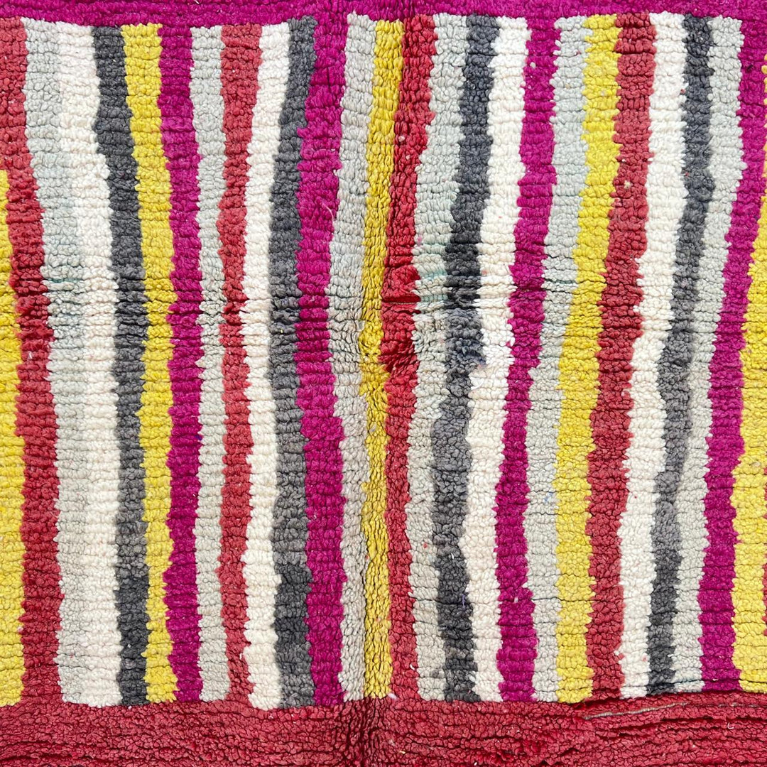 Vintage Moroccan striped wool rug with red pink yellow and gray Berber pattern, handmade in Morocco