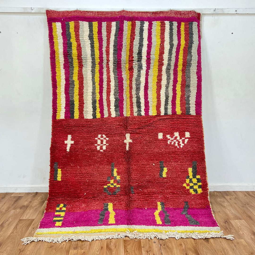 Vintage Moroccan striped wool rug with red pink yellow and gray Berber pattern, handmade in Morocco