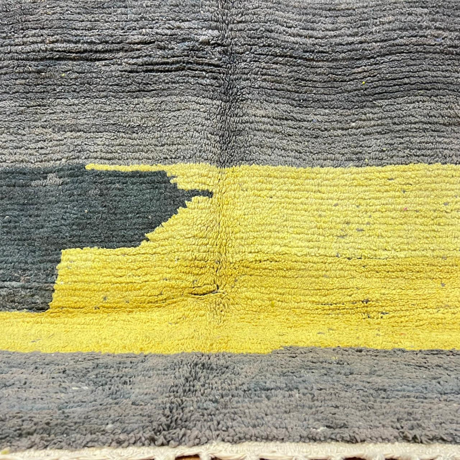 Modern vintage Moroccan wool rug in grey and yellow with geometric design, handwoven from natural wool in Morocco.