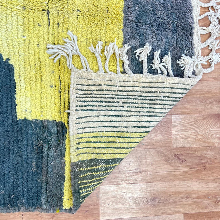 Modern vintage Moroccan wool rug in grey and yellow with geometric design, handwoven from natural wool in Morocco.