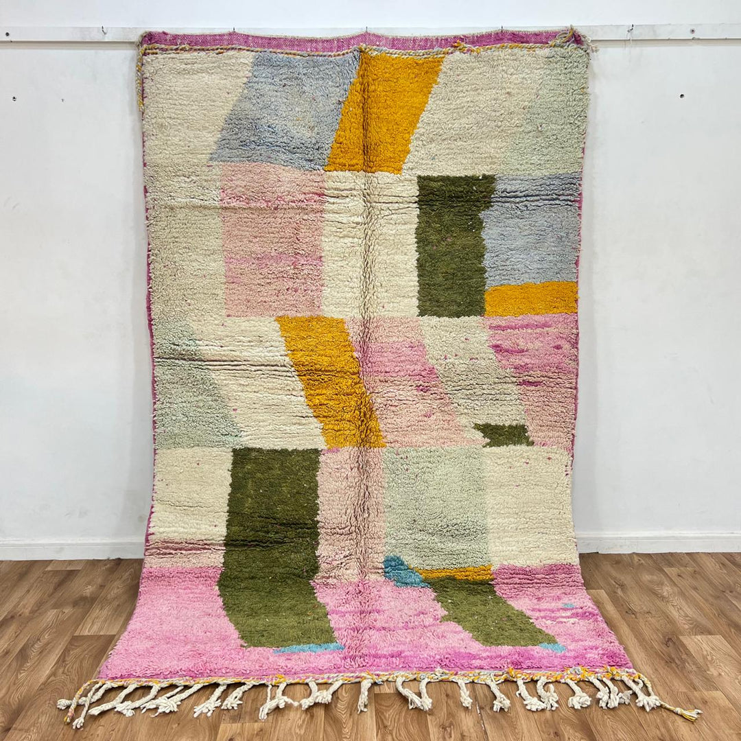 Vintage Moroccan wool rug with soft pastel geometric color-block design in ivory, pink, green, and mustard tones, handwoven by Berber artisans