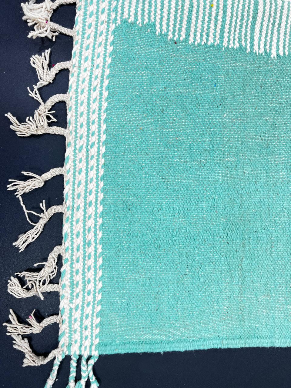 Handmade Moroccan Kilim runner rug with pastel green, blush pink, and white geometric design in flatweave texture.