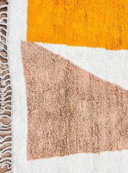Handmade abstract Moroccan runner rug in white wool with ochre, sand beige and gray organic shapes.