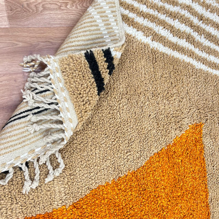 Handmade Moroccan wool rug with modern earth-tone geometric design. Soft plush texture, minimalist style, and artisan crafted.
