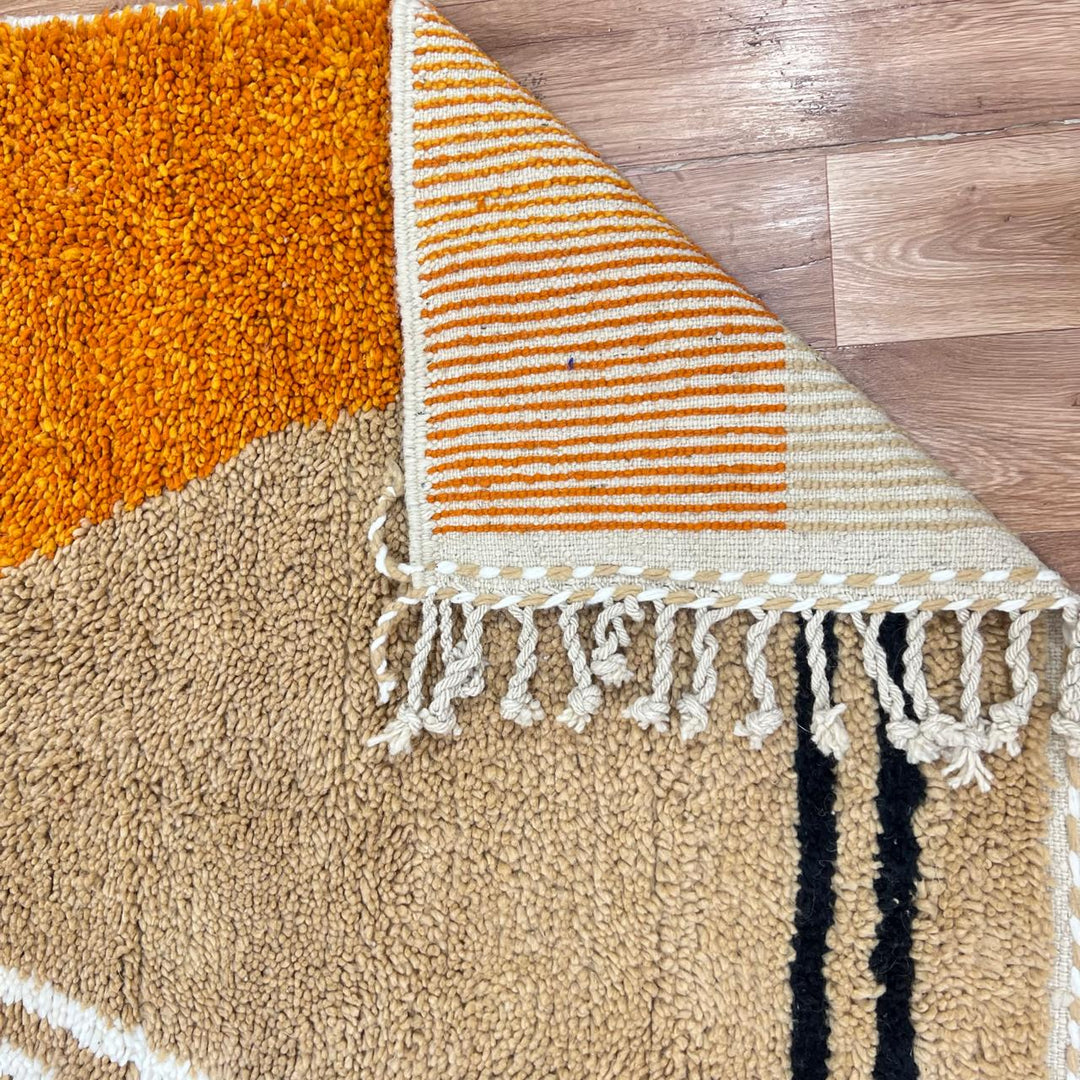 Handmade Moroccan wool rug with modern earth-tone geometric design. Soft plush texture, minimalist style, and artisan crafted.