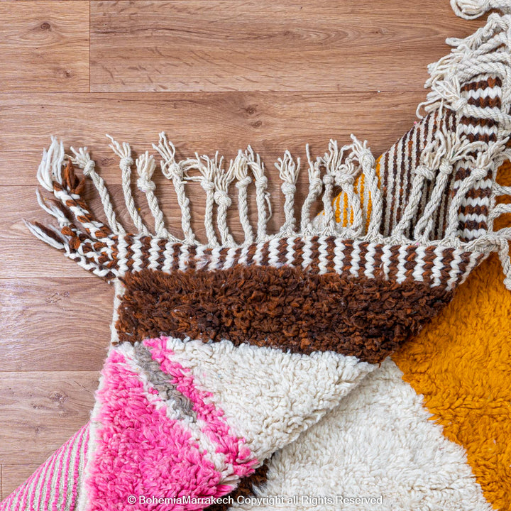 Colorful Moroccan Beni Ourain shag rug with diamond motifs, handmade from wool