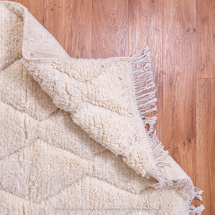 White handmade Moroccan wool rug with subtle geometric Beni Ourain diamond pattern