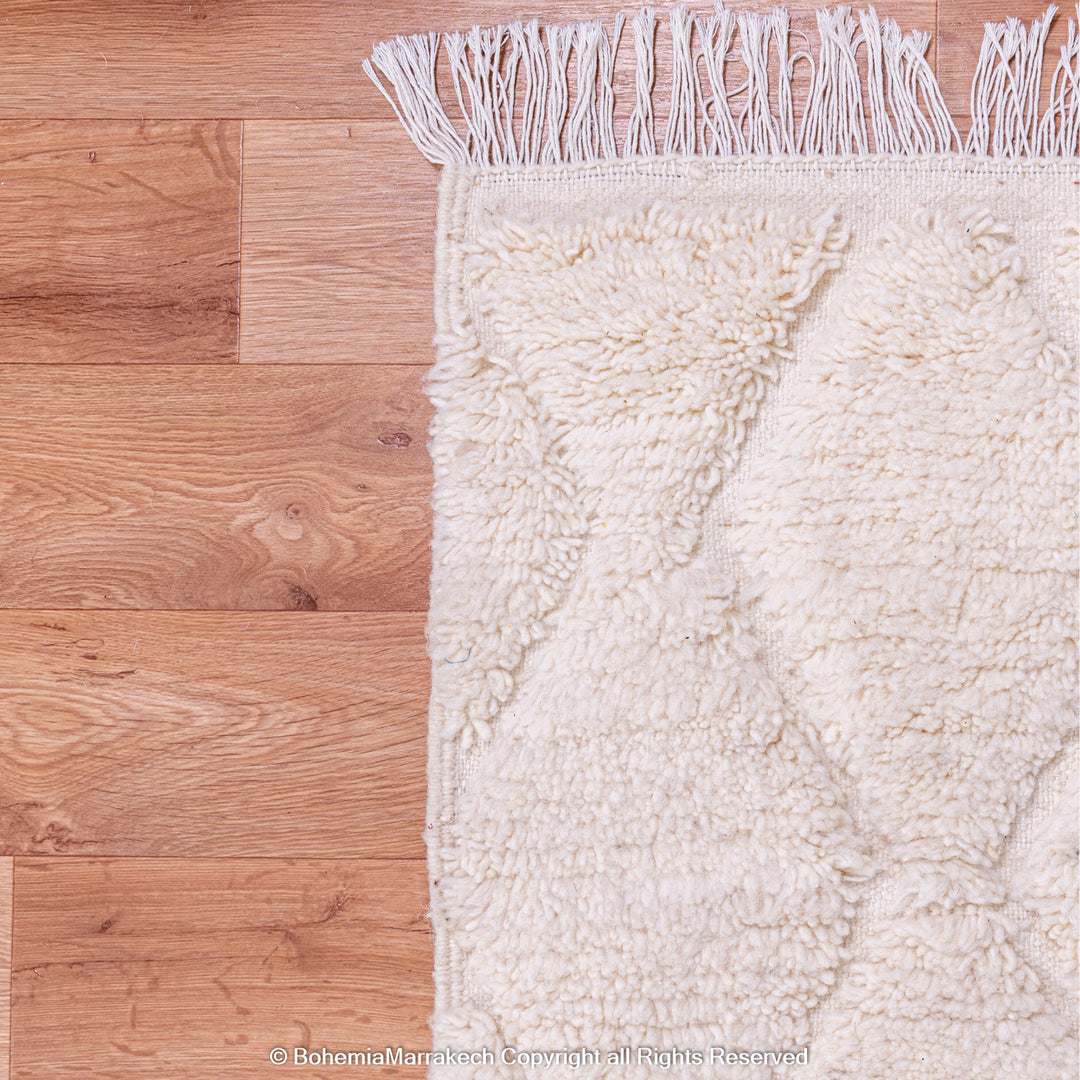White handmade Moroccan wool rug with subtle geometric Beni Ourain diamond pattern
