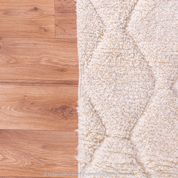 White handmade Moroccan wool rug with subtle geometric Beni Ourain diamond pattern