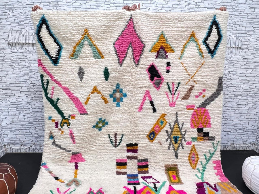 Natural white Moroccan Berber wool rug with colorful symbolic patterns