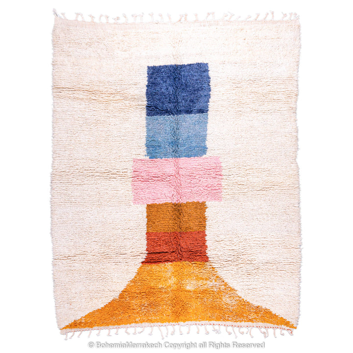 Handmade Moroccan rug with colorful geometric design, featuring blue, pink, orange blocks on wool shag carpet.