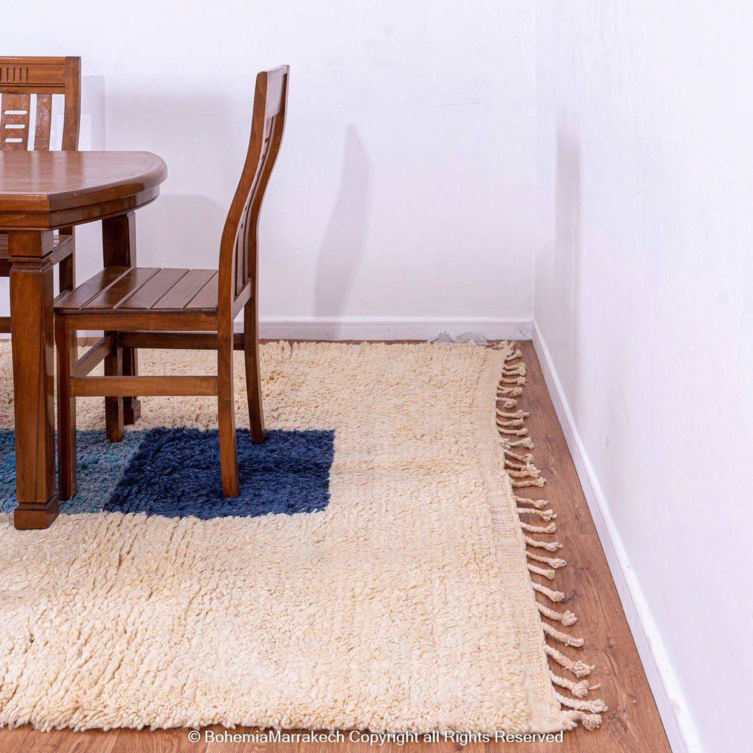 Handmade Moroccan wool shag rug in dining room with blue geometric design, showcasing authentic craftsmanship and modern style.