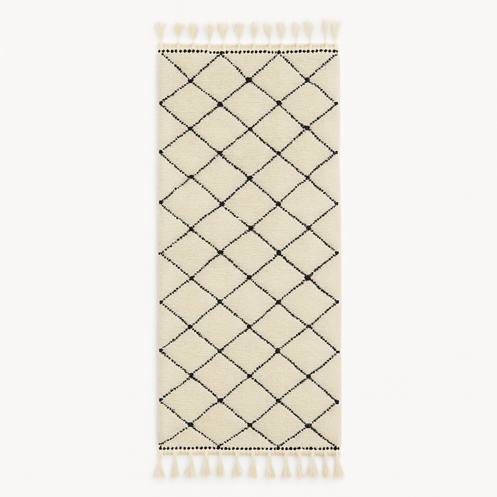 Handmade Moroccan runner rug with classic black diamond lattice design on a white wool background, crafted by Berber artisans.