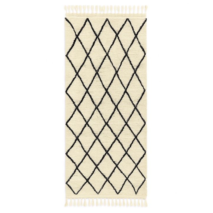 Handmade Moroccan runner rug with classic black diamond lattice design on a white wool background.