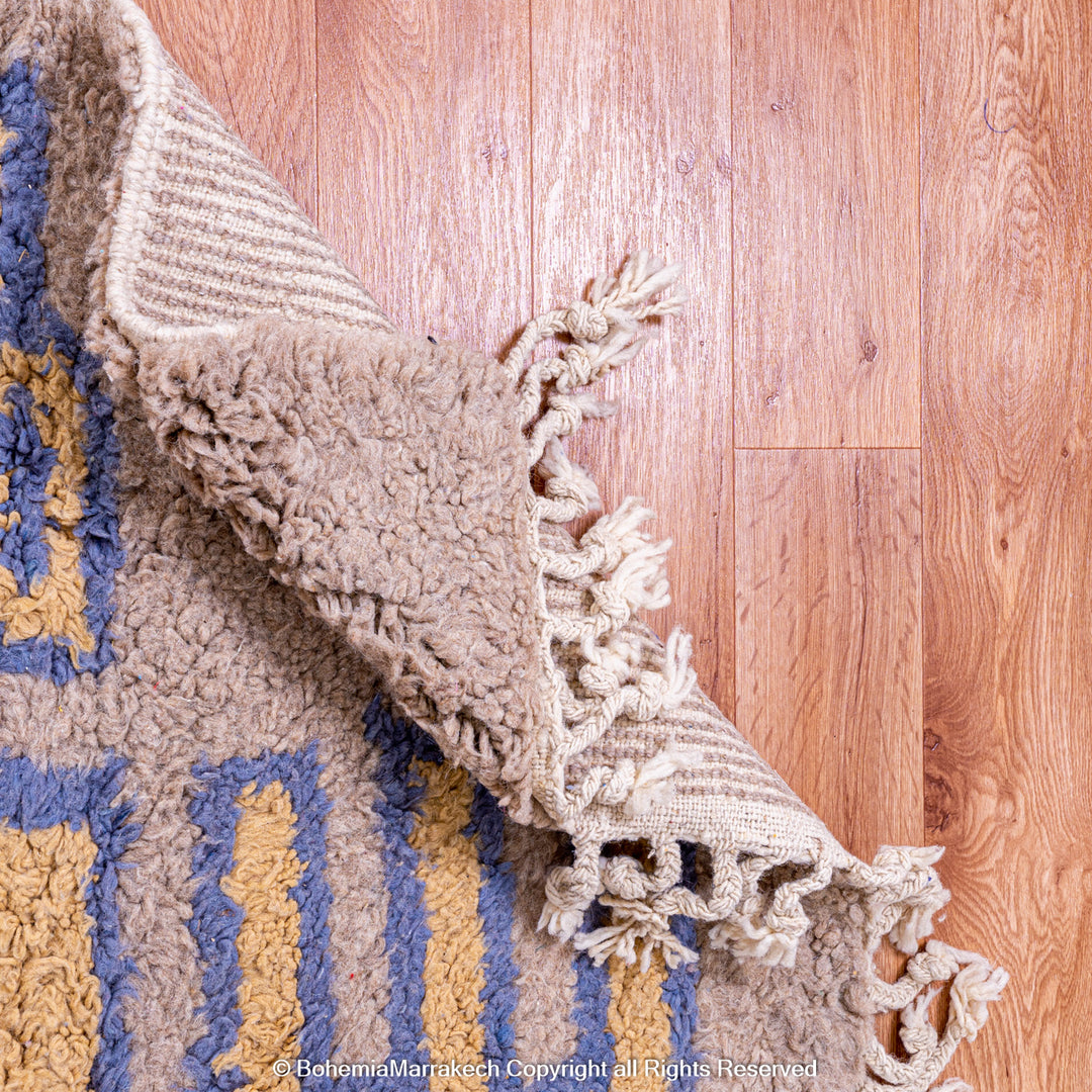 Modern handmade Moroccan wool rug in brown with Berber-style abstract border design