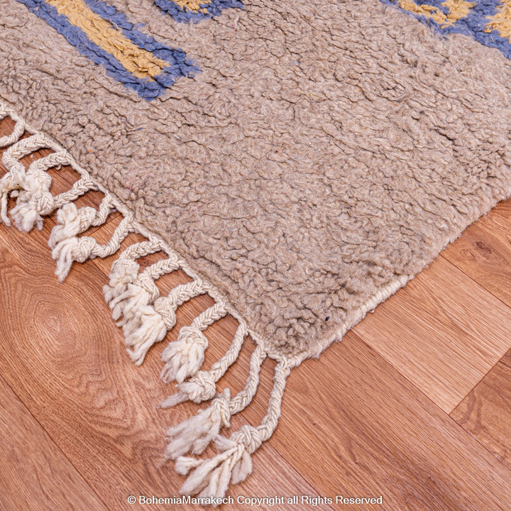 Modern handmade Moroccan wool rug in brown with Berber-style abstract border design