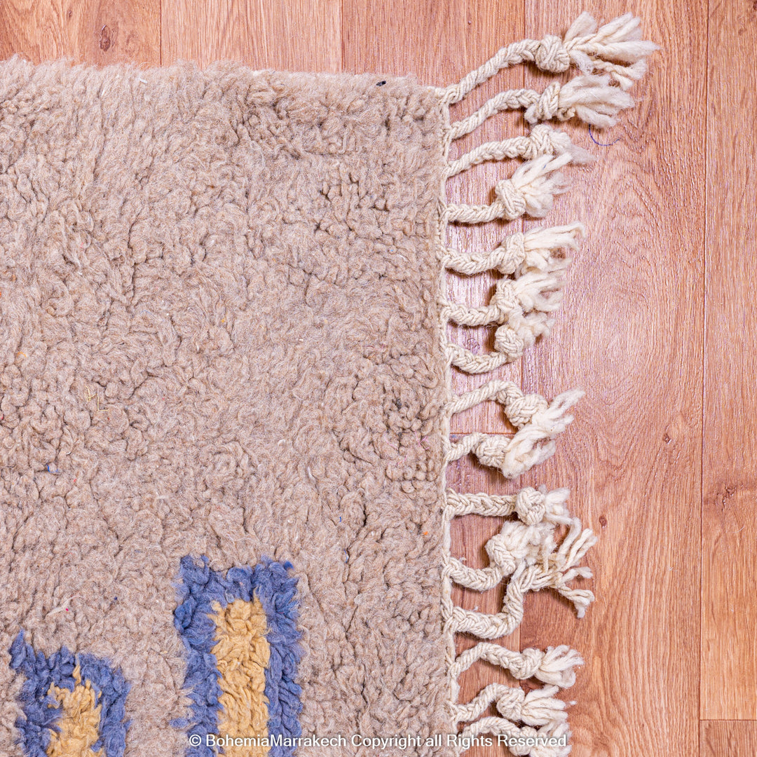 Modern handmade Moroccan wool rug in brown with Berber-style abstract border design