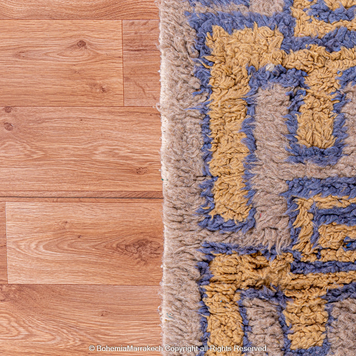Modern handmade Moroccan wool rug in brown with Berber-style abstract border design