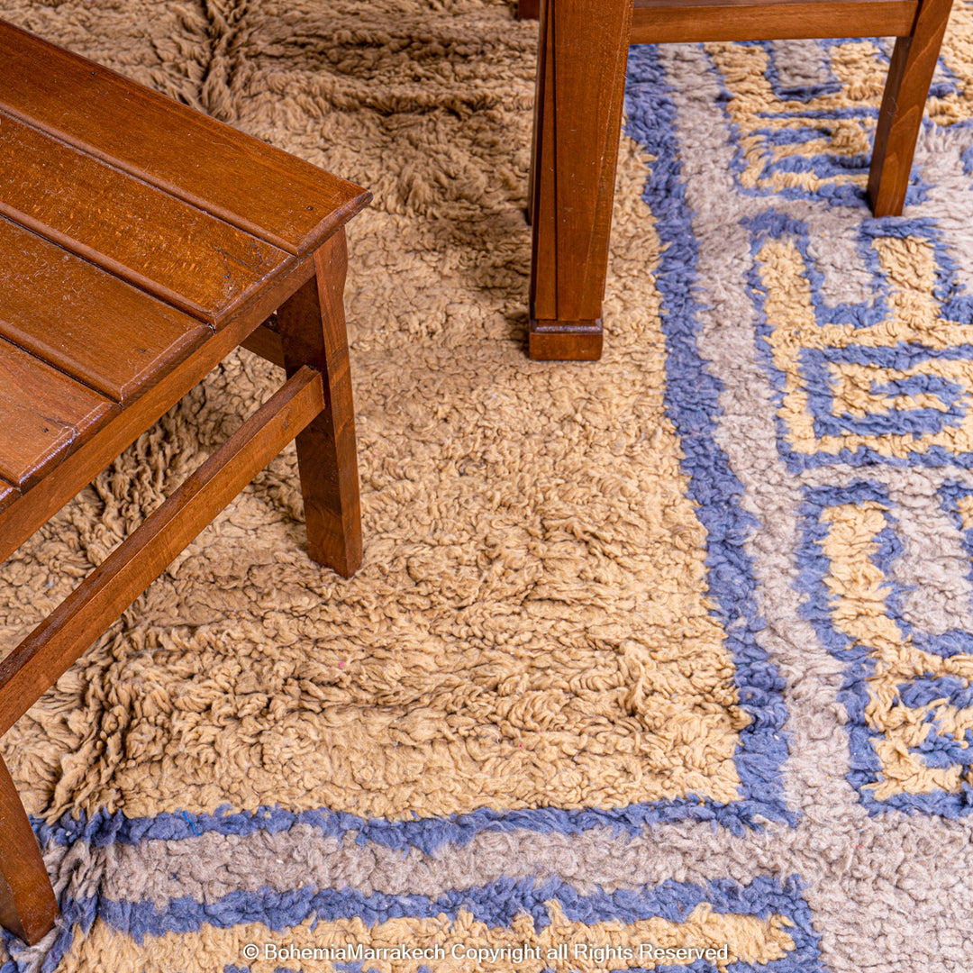 Modern handmade Moroccan wool rug in brown with Berber-style abstract border design
