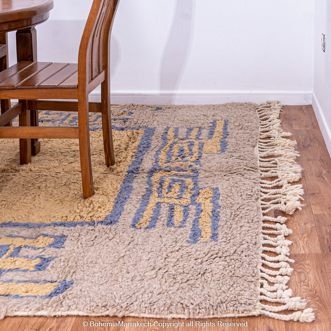 Modern handmade Moroccan wool rug in brown with Berber-style abstract border design