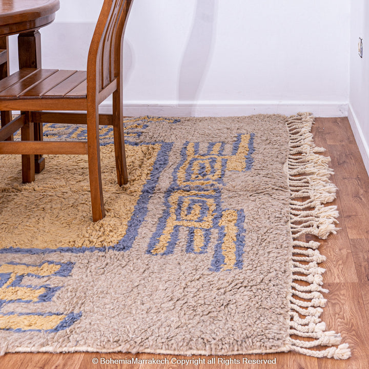 Modern handmade Moroccan wool rug in brown with Berber-style abstract border design