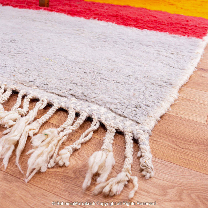 Handmade Beni Ourain Moroccan rug in sunset colors with saffron, red, ivory, and black block pattern