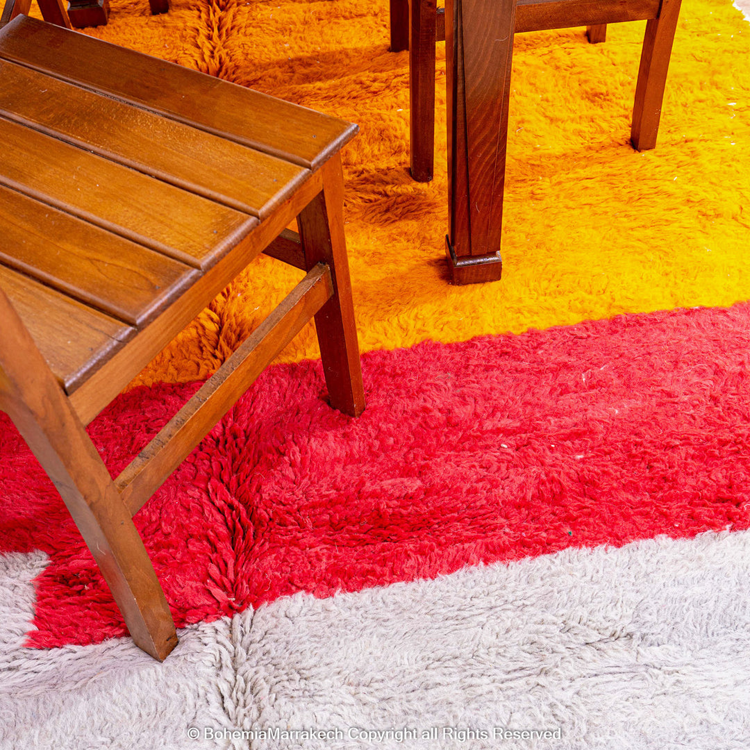 Handmade Beni Ourain Moroccan rug in sunset colors with saffron, red, ivory, and black block pattern