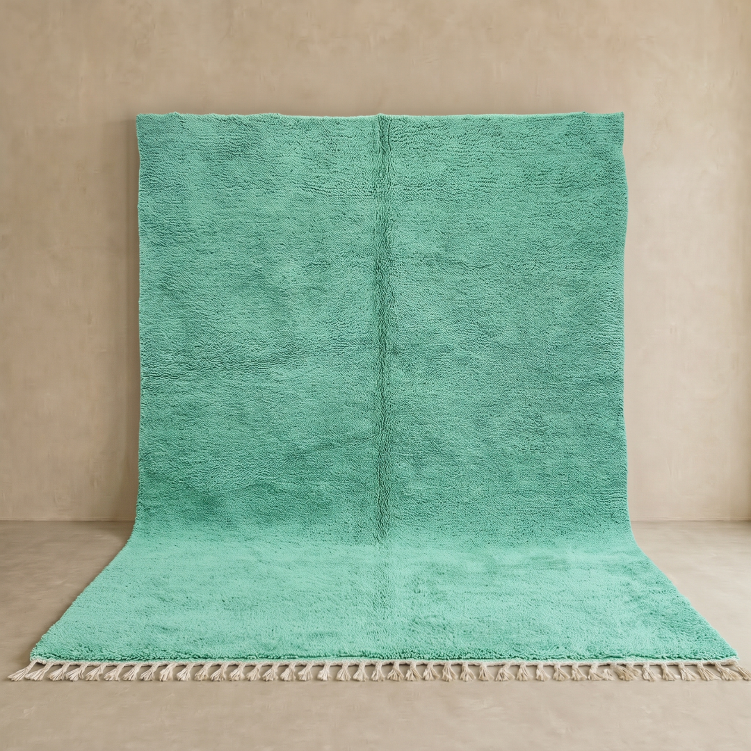 Handmade Moroccan mint green wool rug with plush texture and ivory tassel fringe