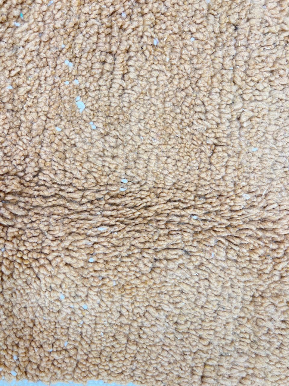 Handmade Moroccan runner rug with brown and white abstract desert-inspired design, crafted from natural wool by Berber artisans.