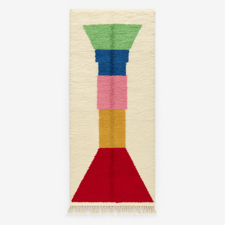 Handmade Moroccan runner rug with colorful geometric design in red, blue, pink, green and mustard on white wool background