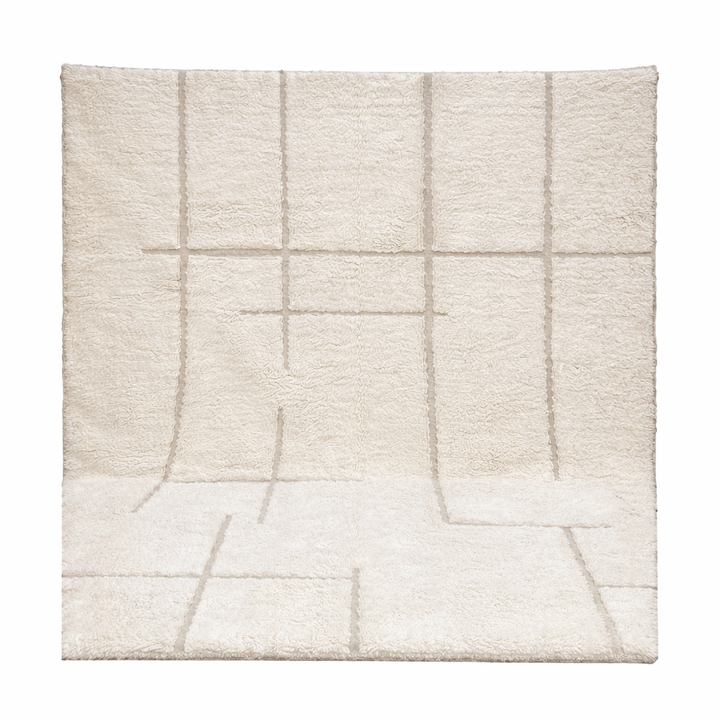 Ivory Moroccan wool rug with subtle raised grid pattern