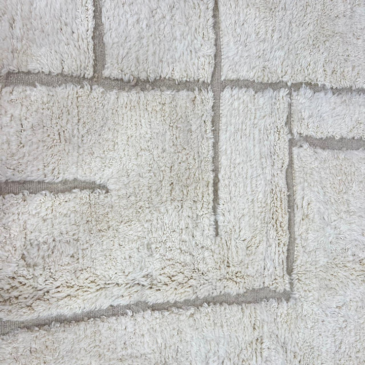 Ivory Moroccan wool rug with subtle raised grid pattern