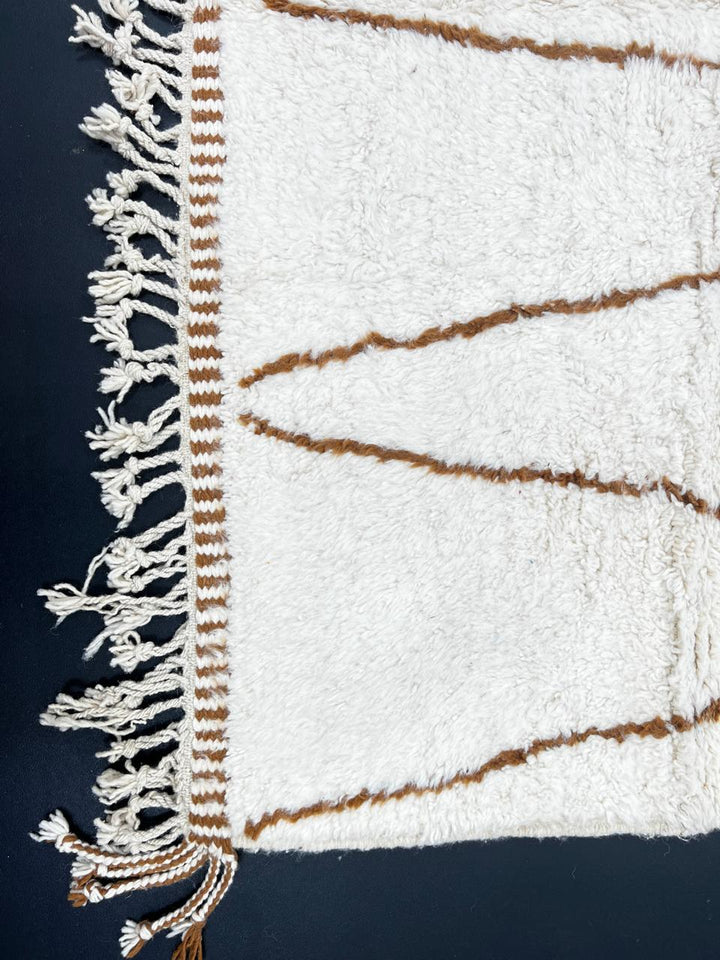 Handmade Moroccan wool runner rug with white background and brown Berber diamond pattern, plush texture, fringed edges – modern boho Moroccan carpet for hallway and corridor decor