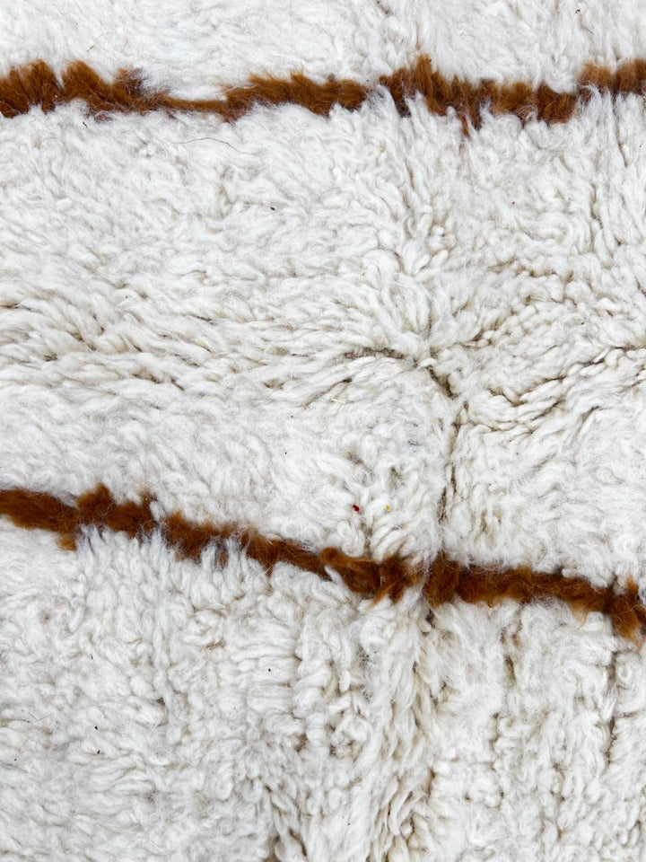 Handmade Moroccan wool runner rug with white background and brown Berber diamond pattern, plush texture, fringed edges – modern boho Moroccan carpet for hallway and corridor decor
