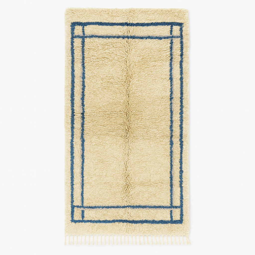 Moroccan wool runner rug with deep blue border design, handmade Beni Ourain Berber carpet, soft shag texture and traditional geometric pattern