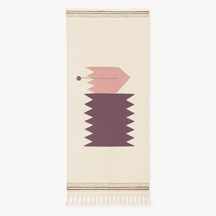 Handwoven Moroccan kilim runner rug with minimalist blush pink and plum geometric pattern on white flatweave wool background.