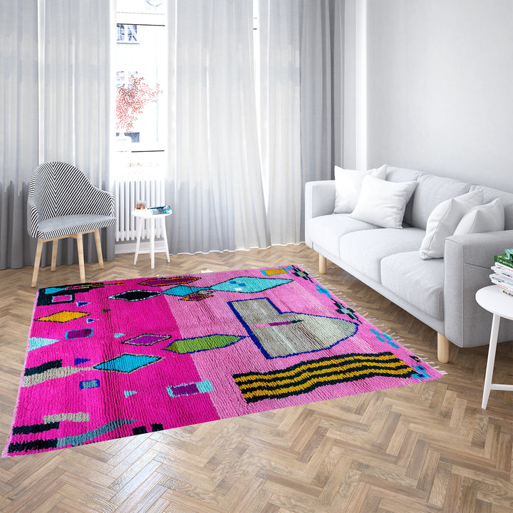 Pink Moroccan Boujaad rug with colorful geometric motifs, handmade in soft wool by Berber artisans