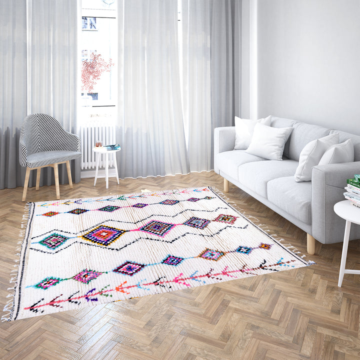 Handwoven colorful Moroccan rug with Berber diamond motifs on white wool base