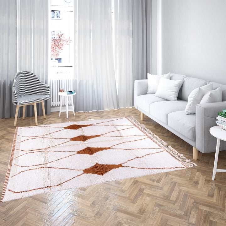 Hand-knotted Moroccan Beni Ourain wool rug with abstract brown Berber motifs on a white background