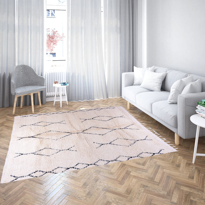 Handmade Beni Ourain Moroccan rug with black diamond pattern on ivory wool