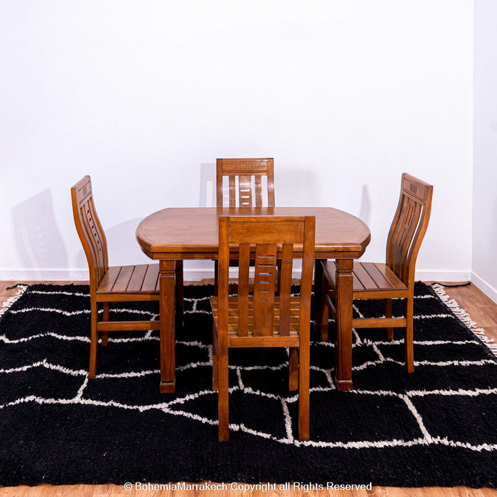 Solid black Moroccan rug with hand-knotted white tribal lines
