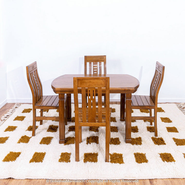 Handmade Moroccan rug with brown checkered pattern on white wool background