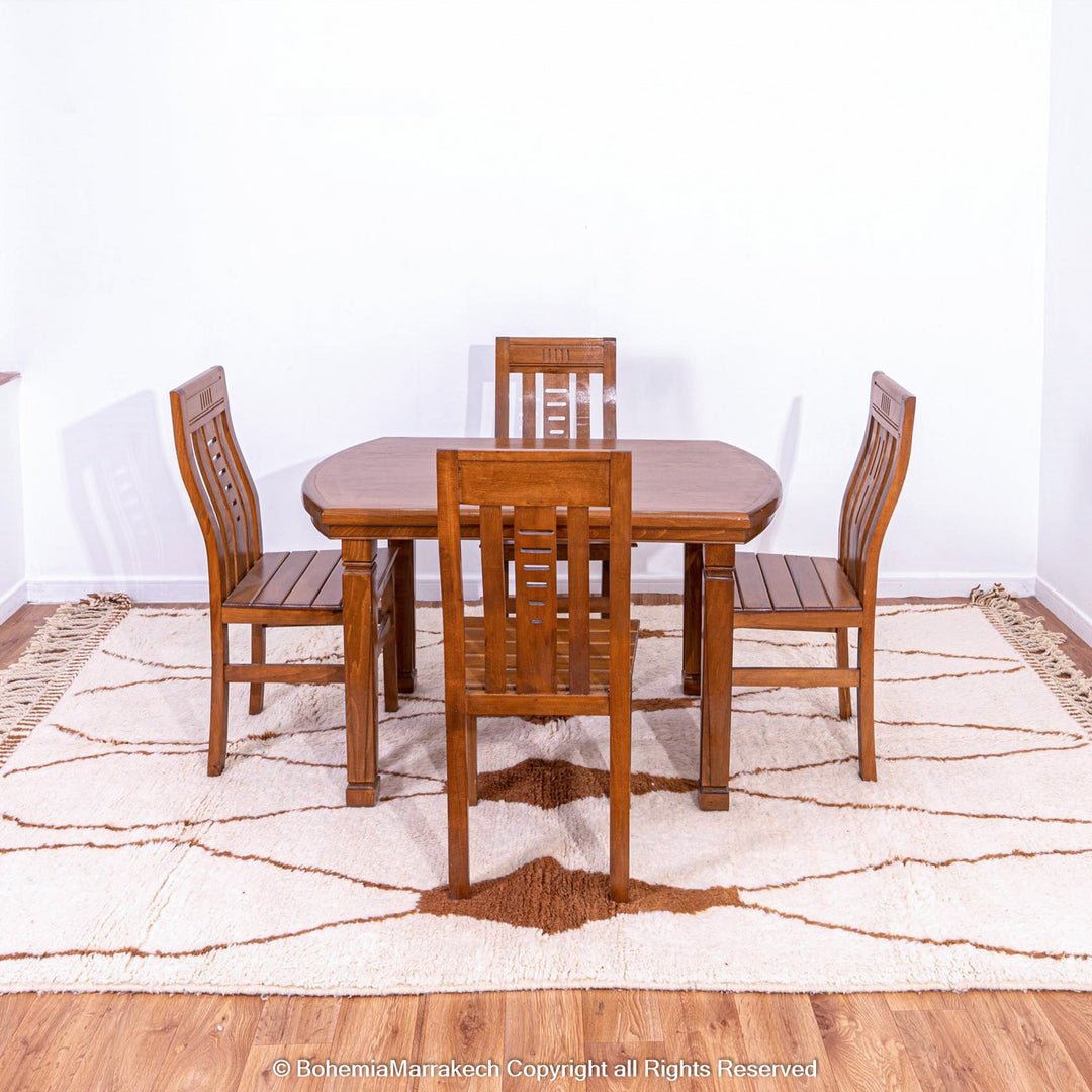 Hand-knotted Moroccan Beni Ourain wool rug with abstract brown Berber motifs on a white background