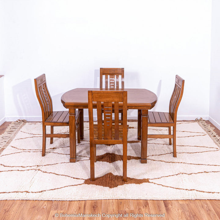 Hand-knotted Moroccan Beni Ourain wool rug with abstract brown Berber motifs on a white background