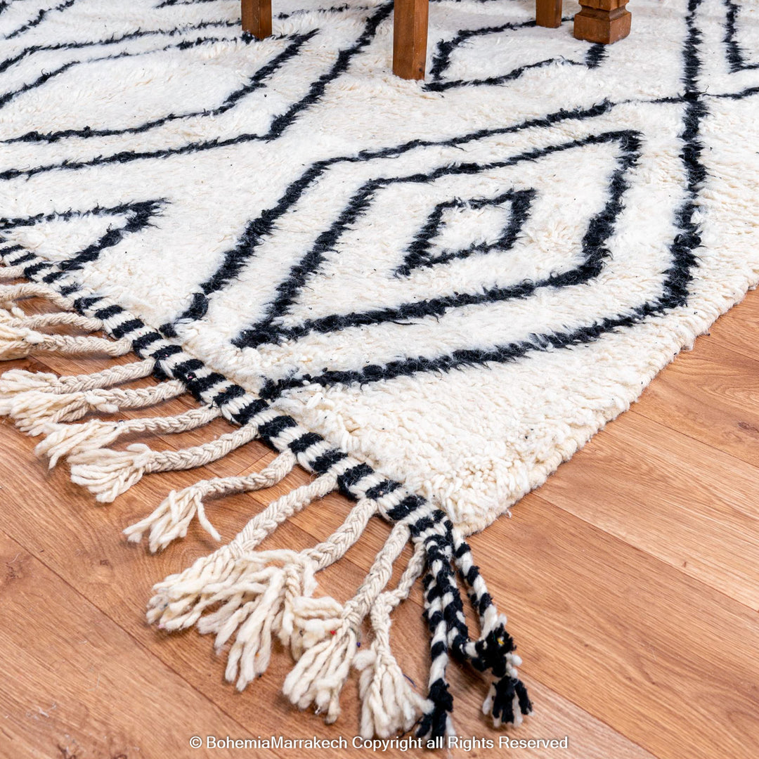 Handwoven Beni Ourain Moroccan runner rug with black diamond pattern on natural wool