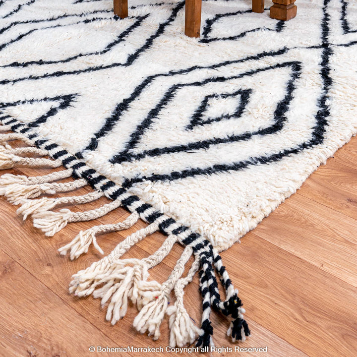 Handwoven Beni Ourain Moroccan runner rug with black diamond pattern on natural wool