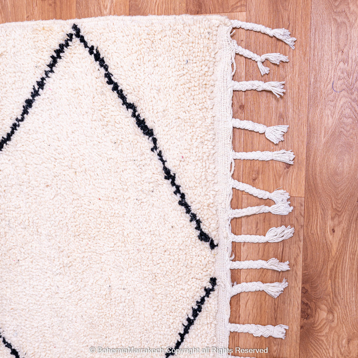 Hand-knotted Beni Ourain Moroccan rug with black diamond lines on ivory wool – handmade Berber carpet
